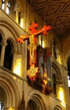 Picture of cross hanging from church ceiling